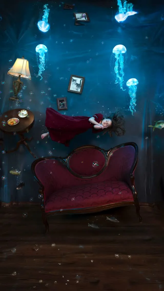 Our family made a room float for a photo! 🪼💙#CanonPartner 

Weeks of planning and building came down to this one moment 😳. For this photo, we wanted to capture a floating, underwater dream world in-camera, so we got to work! We decided to make jellyfish props that looked real on camera, so we did a bunch of research and brainstorming. We ended up doing a combination of hot glue, fiber optic lights, LED strips lights, and ribbon. It’s always the things you least expect that take the longest. In this case, it was searching for the perfect jellyfish shaped bowl. Once we found that, we spent nearly a week making and remaking the jellies until we got it right 😅. Once the set was finished, we had one chance to capture it because we were leaving on a two week trip the next day. Down to the wire! Eloise rested on the platform while Emma steered the bubbles, Oliver moved the jellyfish, Nick handled the leaf blower, and I captured it all with my @canonusa EOS R5 Mark II and RF24mm F1.4 L VCM Lens. This is such a powerful duo! I can switch back and forth between videos and photos seamlessly during photoshoots now. This is so helpful when I am capturing behind the scenes as well as the final photo! I can’t believe how well Canon’s new RF L Series Hybrid lenses can capture handheld video. I never use a gimbal anymore! 📸: f/2.5, 1/250 seconds, 1600 ISO #CanonCreator 
.
.
.
.
.
.
#photoshoot #behindthescenes #creative_portraits #creativephotography #magical #photographyart #photographytricks #photographylovers #lowlightphotography #creative #magicofchildhood #momsofinstagram #familyphotography